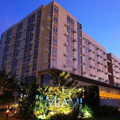a large building with a sign in front of it at Lilian Stanford Suites 2 South Forbes Inchican Silang Cavite in Silang