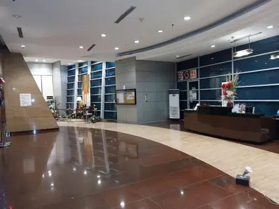 a lobby with a reception desk in a building at MANILA BAY FRONT DELUX Pearl of the orient in Manila
