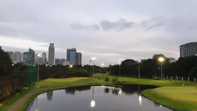 a view of a golf course with a pond at MANILA BAY FRONT DELUX Pearl of the orient in Manila
