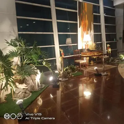 a living room with plants and lights on the floor at MANILA BAY FRONT DELUX Pearl of the orient in Manila