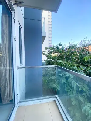a balcony with a fish tank on the side of a building at Hotel Type Condo Near NAIA Manila Airport in Manila