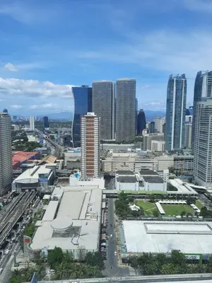 a view of a city with many tall buildings at SMDC FAME Residences David 's place in Manila