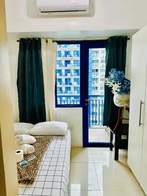 a small room with a bed and a window at Sea Residences Tower F Angel 0975 - 811 - 9490 in Manila
