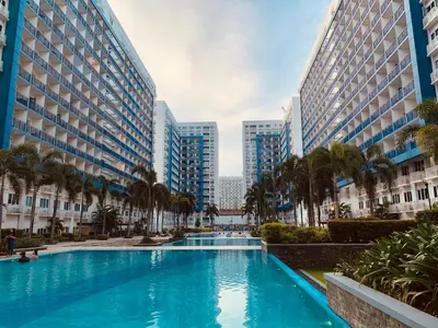 a swimming pool in a city with tall buildings at Sea Residences Tower F Angel 0975 - 811 - 9490 in Manila