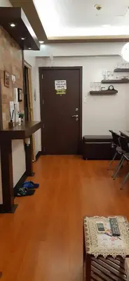 a room with a black door and a wooden floor at Sarasota Residential Resort cluster 4 Unit 6B and 6C by Manny Newport Blvd, across NAIA T3 & near Resorts World Manila, Pasay City in Manila