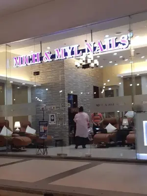 a man walking in front of a nail salon at Sarasota Residential Resort cluster 4 Unit 6B and 6C by Manny Newport Blvd, across NAIA T3 & near Resorts World Manila, Pasay City in Manila