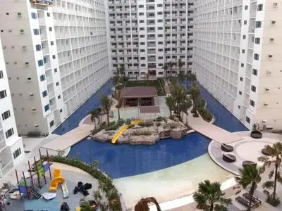 an aerial view of a water park in a city at Sabina's one bedroom condo at Shore tower C in Manila
