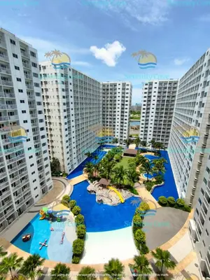 an aerial view of a resort with a water park at Shore Residences Mall of Asia Pool View 200mbps Free Wi-Fi in Manila