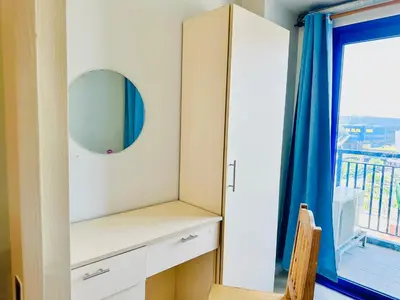 a dressing room with a mirror and a window at Sea Residences - Property Val Alano 0995-448-8872 in Manila