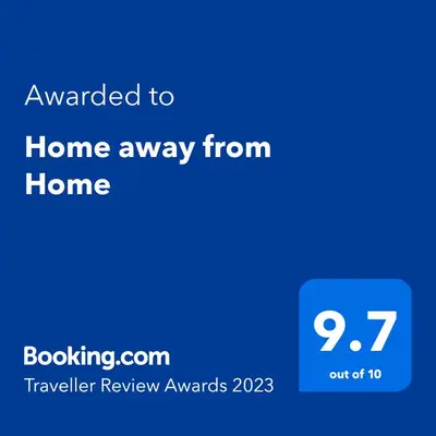a blue screen with the text awarded to home away from home at Home away from Home in Manila