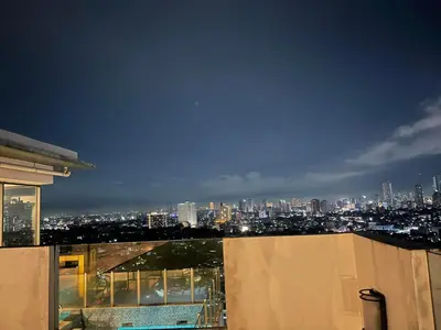 a view of a city skyline at night at Spacious One Bedroom 20888 in Manila