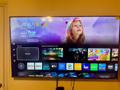 a flat screen tv on a wall with many apps at Pandora’s Nest in Manila