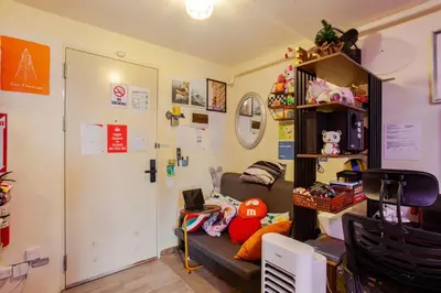 a living room with a couch and a desk at Pandora’s Nest in Manila