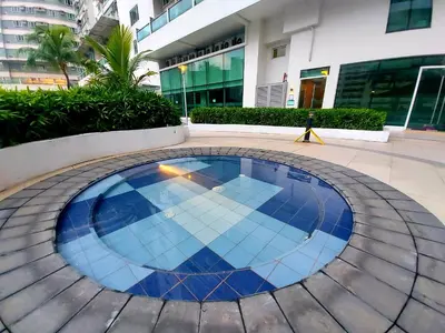 a swimming pool in the middle of a building at Great Place at Beacon Tower Makati in Manila