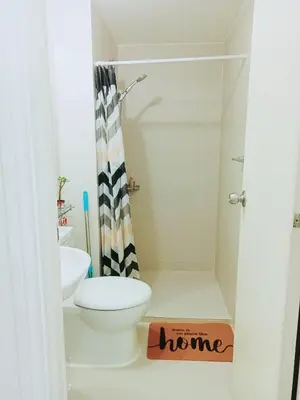 a bathroom with a toilet and a sink at S-A-F-E Haven Resort Staycation in Manila