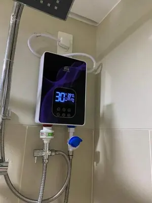 a digital clock on the wall of a shower at Fame Residences Tower-1 Unit 3207 in Mandaluyong 1 Br w Balcony City view in Manila