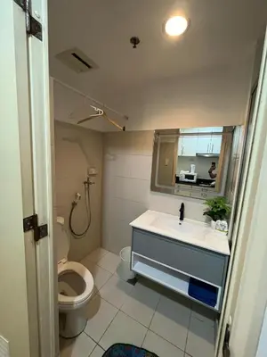 a bathroom with a sink and a toilet at Easy Stay Sea Residences in Manila