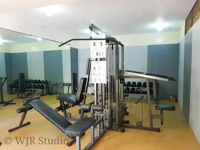 a gym with cardio equipment in a room at Queen Bed Deluxe- Contemporary Style in Manila