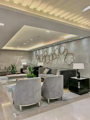 a living room with two chairs and a couch at SMDC S Residences MiCasa, MOA area in Manila