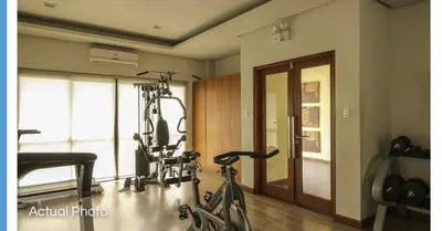 a room with a gym with a bike in it at Lovely 2 BR Condo with FREE Secured Parking in Manila