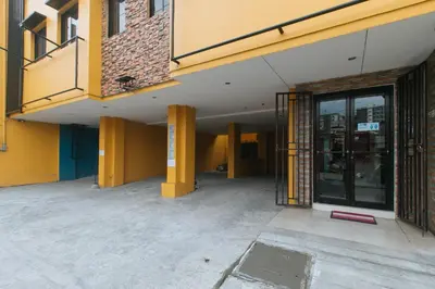 an empty hallway of a building with a door at 4720 Silverio Suites Paranaque City in Manila