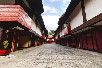 an empty street in a building with red roofs at Town and Country Hotel V Mapa in Manila