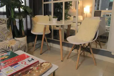 a living room with two chairs and a table at A2J BGC Luxury 2BR Loft Near Burgos Circle, Malls in Manila