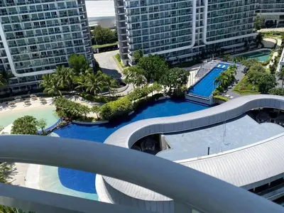 an overhead view of a swimming pool in a city at AZURE A6 beachpool with Balcony Wifi near mall airport in Manila
