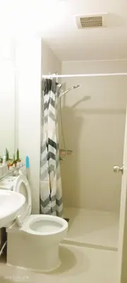 a bathroom with a toilet and a shower curtain at S-a-f-e Haven Resort Staycation in Manila