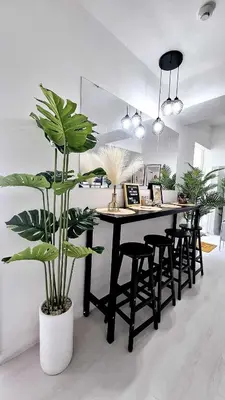 a dining room with a table and some plants at S-a-f-e Haven Resort Staycation in Manila