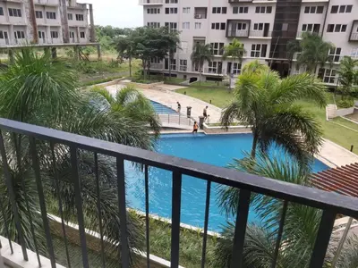 a view of the pool from the balcony at Monteluce 2 BR LOFT with pool 825 in Silang