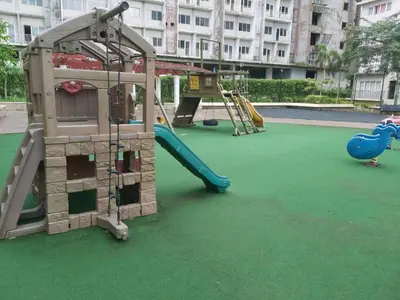 a playground with a slide and a slideintend at Affordable Tagaytay Monteluce 2 BR with Pool G28 in Silang
