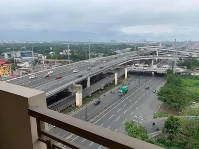 a view of a highway with cars and a bridge at Ramiro Haven Staycation in Manila