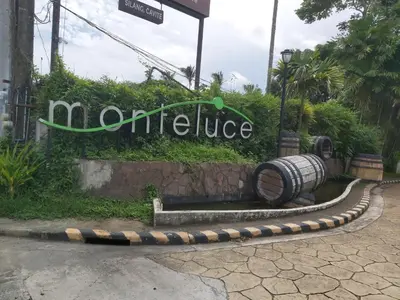 a sign for the entrance to a hotel at Affordable Tagaytay Monteluce 1BR with Pool G10 in Lalaan Primero