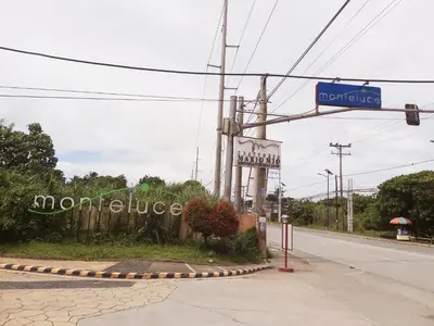 a sign for a morgue on the side of a road at Affordable Tagaytay Monteluce 1BR with Pool G10 in Lalaan Primero