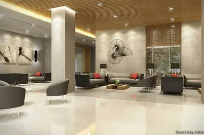 a lobby with couches and chairs in a building at S Residences MOA Condo Stunning Boutique Hotel Type T1 in Manila