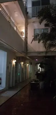 an empty hallway of a building at night at Innsite Room Rentals in Manila