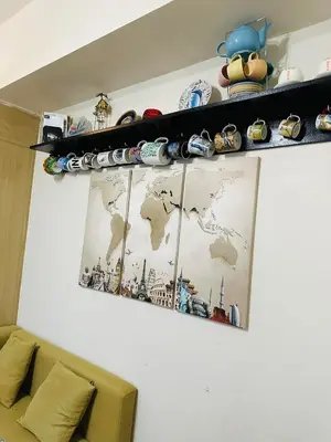 a shelf with toy cars and a map of the world at 1 Bedroom with balcony Near Airport Bgc Taguig City in Manila