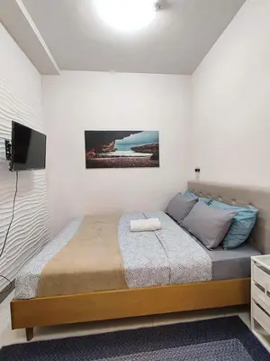 a bedroom with a large bed in a room at Coast Residences, Roxas Blvd, Pasay City in Manila
