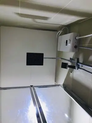 an empty room with a machine in a kitchen at Cozy Bedroom FAME Condo Greenfield EDSA MRT Shaw in Manila