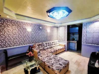 a living room with a couch and a table at City Tower Condominium Transient Inn in Manila