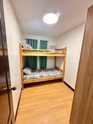 a small room with two bunk beds in it at Fetalino's Place Imus in Imus