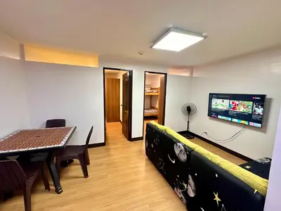 a living room with a couch and a table at Fetalino's Place Imus in Imus