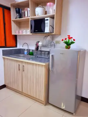 a kitchen with a refrigerator and a sink at Fetalino's Place Imus in Imus