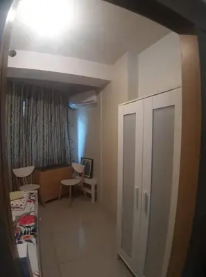 a hospital room with a bed and a cabinet and a bedroom at SHELL RESIDENCE C1 shortwalk MALL OF ASIA NEAR AIRPORT in Manila