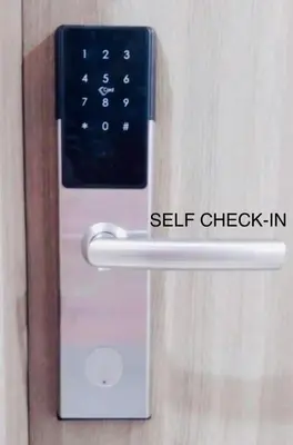 a smart lock on a door with the words self check in at NJ's Place, Shore 1 Residences, MOA Complex, Pasay City, Philippines in Manila