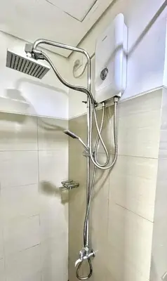 a shower in a bathroom with a shower head at NJ's Place, Shore 1 Residences, MOA Complex, Pasay City, Philippines in Manila