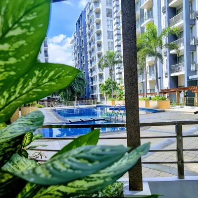 a swimming pool in the middle of a building at Condo Airport NAIA Terminal-3 One Palm Tree Villas in Manila