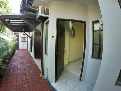 a hallway of a building with a door and a walkway at South Breeze Balibago 3 minutes away from Santa Rosa Commercial Complex in Macabling