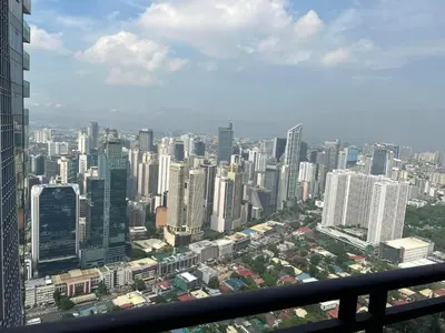 a view of a large city from a skyscraper at Gramercy Residences studio with Balcony Netflix in Manila